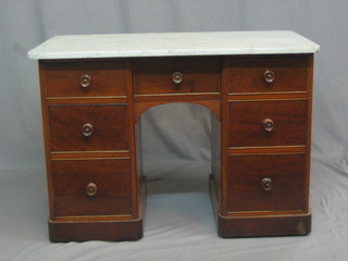 A Victorian mahogany pedestal kneehole wash stand with veined marble top above 7 drawers with tore handles, 40"