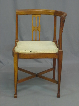 An Edwardian inlaid satinwood corner chair with X framed stretcher, raised on square tapering supports ending spade feet