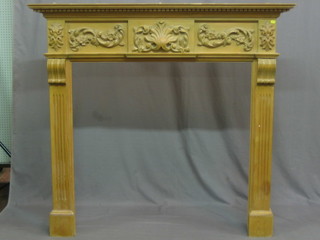 A Georgian style carved pine fire surround 59"