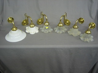 13 various gilt metal wall light brackets, some with shades