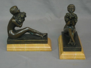 A pair of reproduction Art Nouveau bronze figures of seated ladies, raised on marble bases, 8"