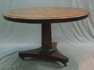A William IV circular mahogany snap top breakfast table, raised on a chamfered column with triform base 46"