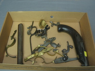 A collection of various flint lock hammers and trigger guards etc