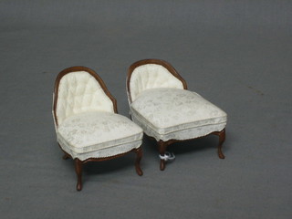 A dolls house Victorian style mahogany day bed upholstered in white material together with a matching nursing chair (2)