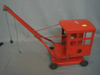 A Triang red metal crane