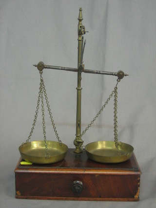 A pair of 19th Century brass and polished steel scales and 6 brass weights