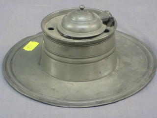 A circular pewter capstan inkwell 7"