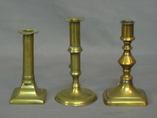 A 19th Century brass candlestick and ejector 6" and 2 others