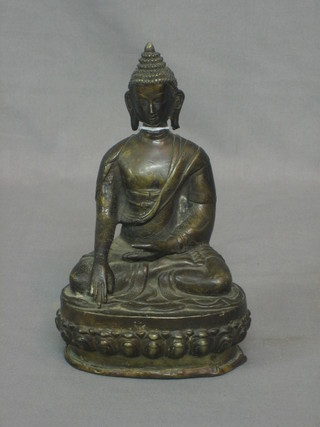 An Eastern bronze figure of a seated Buddha 9"