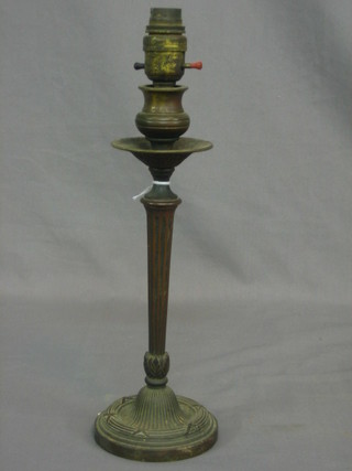 A 19th Century reeded bronze candlestick converted to an electric table lamp 10"