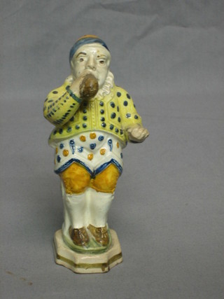 A 17th/18th Century Staffordshire figure in the form of a standing drinking man with dolphin shaped handle 6" (f)