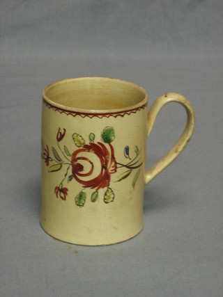 An 18th/19th Century Yorkshire style Creamware tankard with painted floral decoration 4"