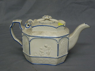 A 19th Century lozenge shaped stoneware teapot with hinged lid (chipped and f) panels decorated cherubs and lions