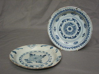 A 17th/18th Century circular blue and white Delft plate  7 1/2" and 1 other (both cracked)