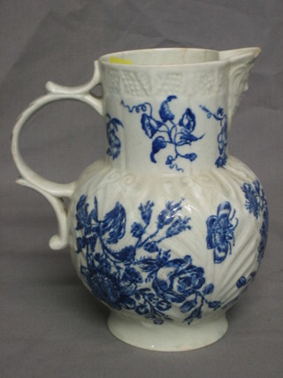 An 18th Century Worcester style blue and white cabbage leaf jug with mask spout (chipped and cracked, chip and star crack to base) 8"