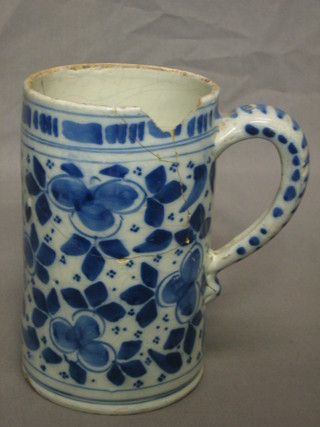 An Ismic style blue and white pottery tankard, base marked 1, decorated birds (f and r and with chip to rim) 6 1/2"