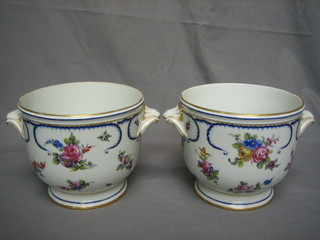 A pair of 19th Century Sevres porcelain twin handled  ice pails with floral decoration, (bases chipped), base with blue cipher mark 8"
