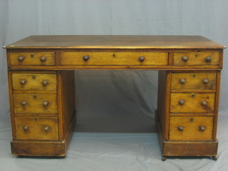 A Victorian pine desk fitted 1 long drawer above 8 short drawers 52"
