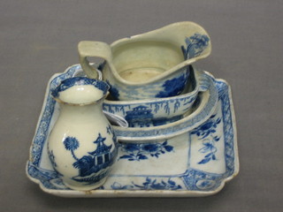 A square blue and white porcelain dish 5" (chip to rim), a childs dolls house blue and white oval meat 4", do. tureen 3"  (cracked) , miniature cream jug 2", miniature club shaped vase 3" (chip to rim)