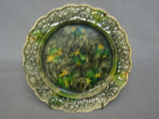 A Whieldon style plate decorated leaves and butterflies 9"  (slight chip and crack to reverse)