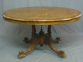 A Victorian oval inlaid figured walnut Loo table, raised on 3 turned columns with tripod base, 53"