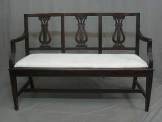 A 19th Century triple chair back settee with lyre shaped back and upholstered drop in seat, raised on square tapering supports 53"