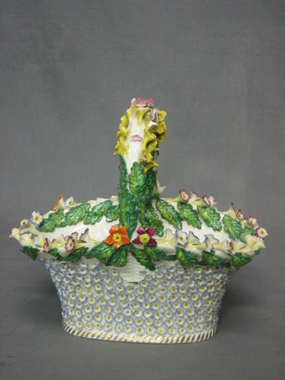 A 19th Century floral encrusted model of a basket 8 1/2" (some damage)
