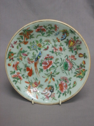 A circular famille vert porcelain bowl decorated birds amidst branches, the base with seal mark  7"