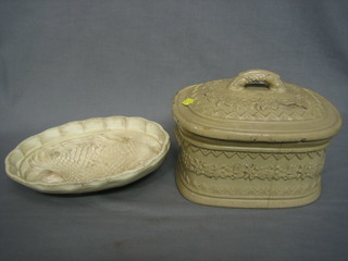 A Victorian white glazed oval tureen and cover 10"  (chip to lid) and a Wedgwood white glazed oval jelly mould decorated a fish 11"