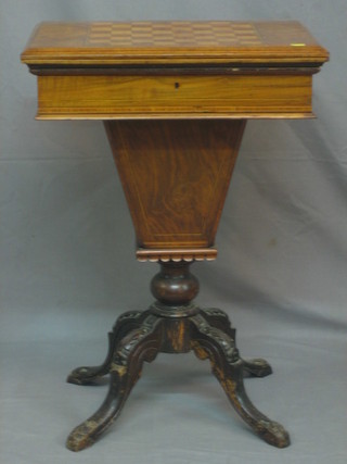 A Victorian square walnut work/games table of conical form with flip over top, inlaid cribbage board and chess board, raised on carved tripod supports 21"