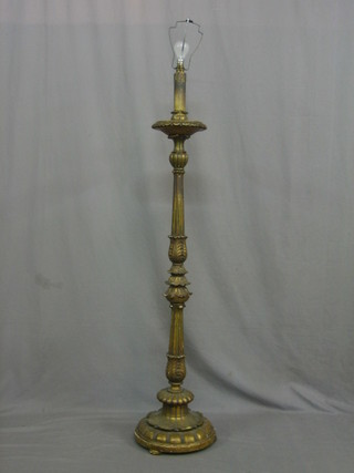 A carved gilt wood and plaster standard lamp