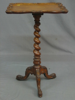 A Victorian carved honey oak rectangular wine table, raised on a spiral turned column with carved tripod base 17"