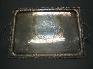 A square silver plated twin handled tea tray with engraved and embossed borders 23"
