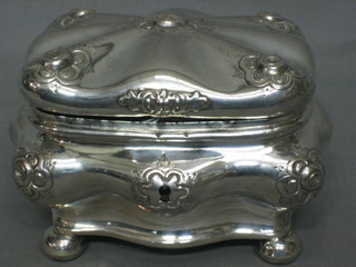 A 19th Century Continental silver embossed cushion shaped caddy or trinket box, raised on bun feet 12 ozs