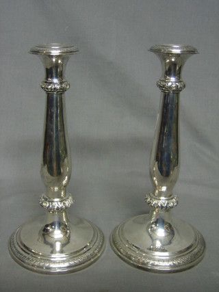A pair of Continental silver candlesticks 11", 18 ozs