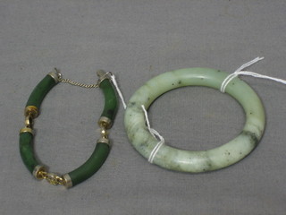 A jade coloured bangle and a jade coloured bracelet
