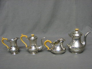 A Continental 4 piece tea/coffee service comprising coffee pot, hotwater jug, 2 cream jugs and a spoon with ivory handles