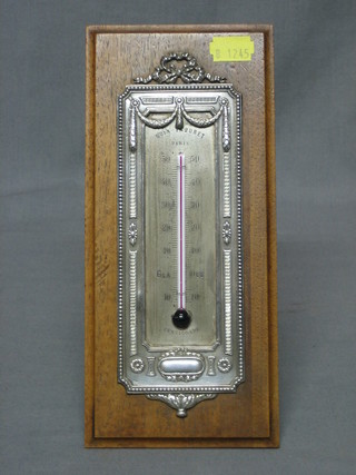A French 19th Century barometer with silvered dial contained in a hardwood easel stand