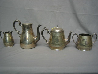 A 4 piece silver plated tea/coffee service comprising teapot, twin handle sugar bowl, milk jug and coffee pot