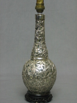An Eastern glass club shaped bottle with pierced silver decoration converted to an electric table lamp  12"