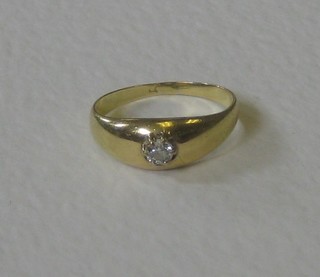 A gold gypsy style ring set a diamond 