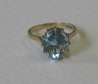 A 9ct gold dress ring set a circular cut aquamarine