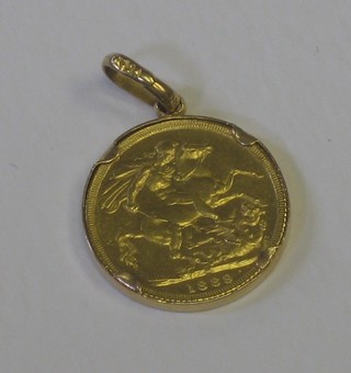 A Victorian 1889 sovereign hung as a pendant in a gilt metal bound
