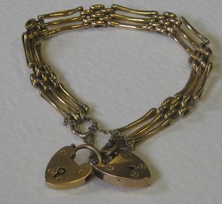 A 9ct gold gate bracelet with 2 heart shaped padlocks