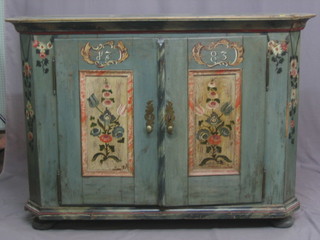 A Continental turquoise painted pine cabinet of lozenge form, marked 1783 and enclosed by handsome doors 59"