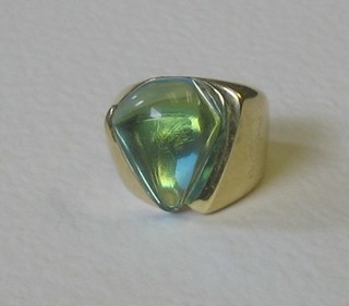 An 18ct gold designer dress ring set a blue stone, signed