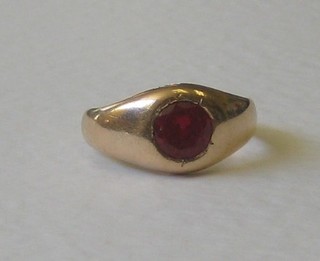 A 15ct gold dress ring set a red stone