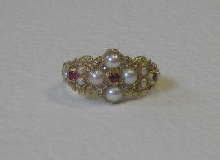 An 18ct yellow gold dress ring set rubies and pearls