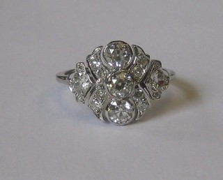 A lady's white gold dress ring set 3 diamonds to the centre supported by numerous diamonds, approx 1.25ct