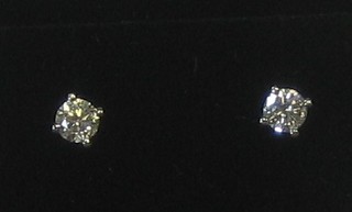A pair of diamond set ear studs, approx 0.50ct